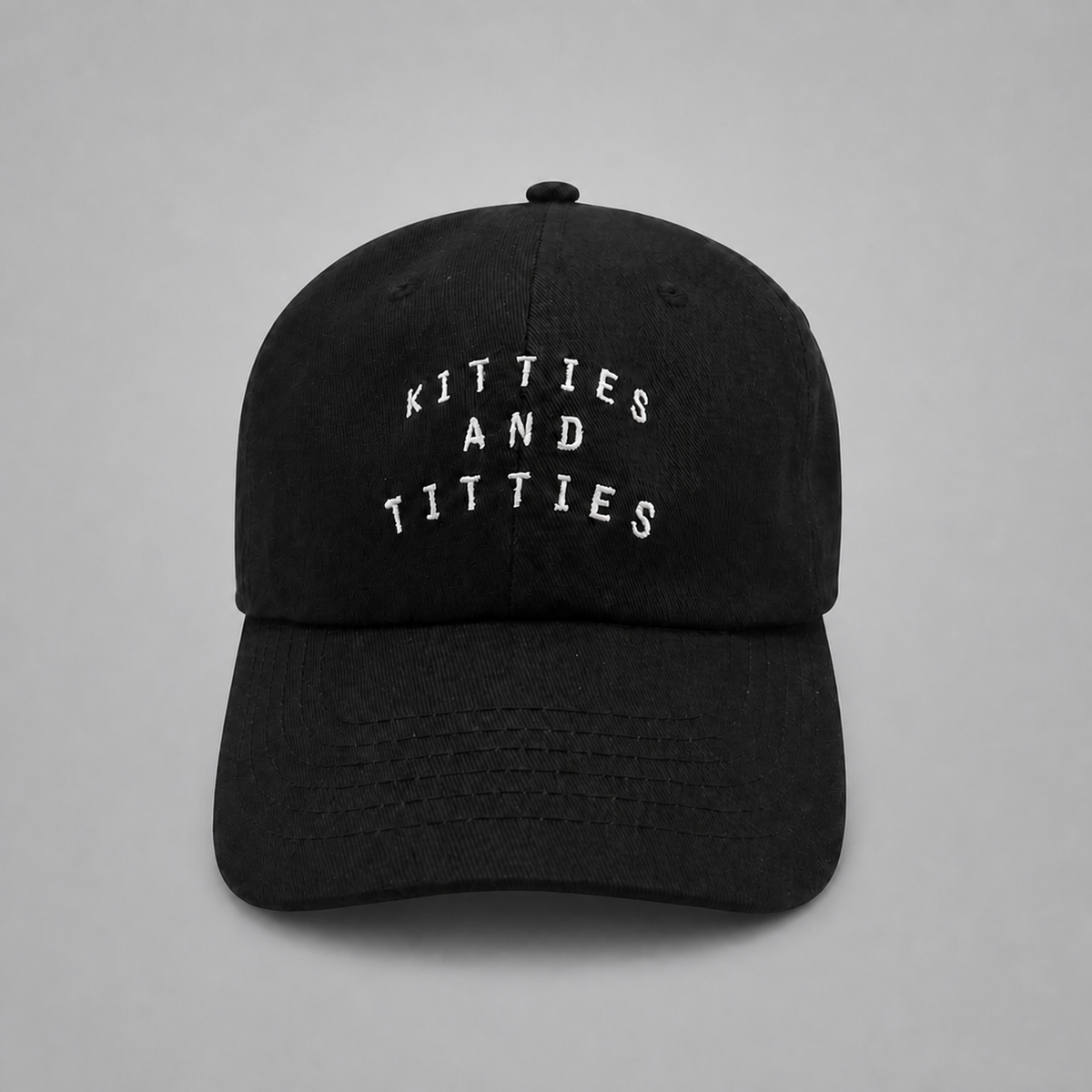 Black KnT Cap on neutral studio gray background