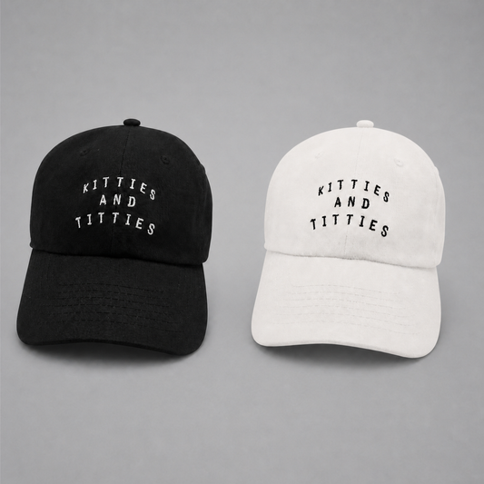 Black and white KnT Cap set on neutral studio gray background