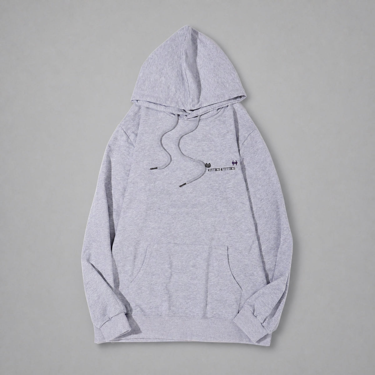 KnT Hoodie on neutral studio gray background