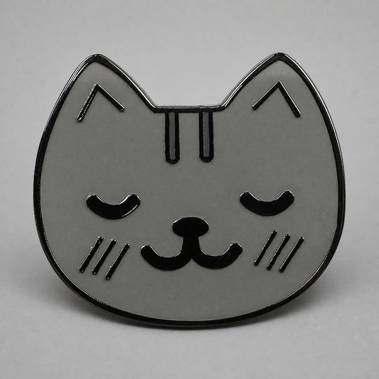 KnT kitty pin on neutral studio gray background