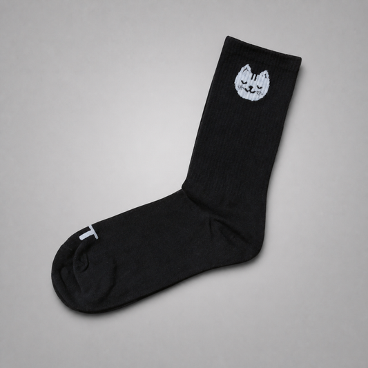 KnT socks pair on neutral studio gray background