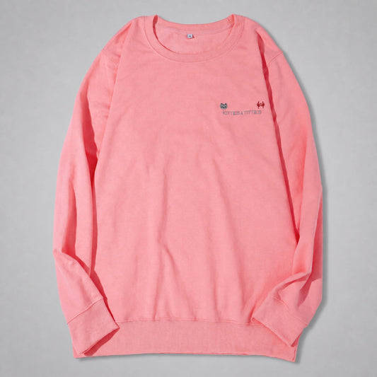 Pink KnT Sweater on neutral studio gray background